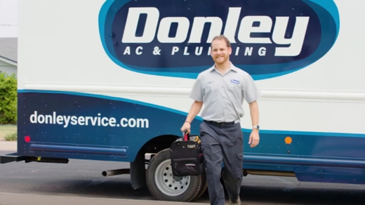 Dan the Plumber in front of the Donley truck