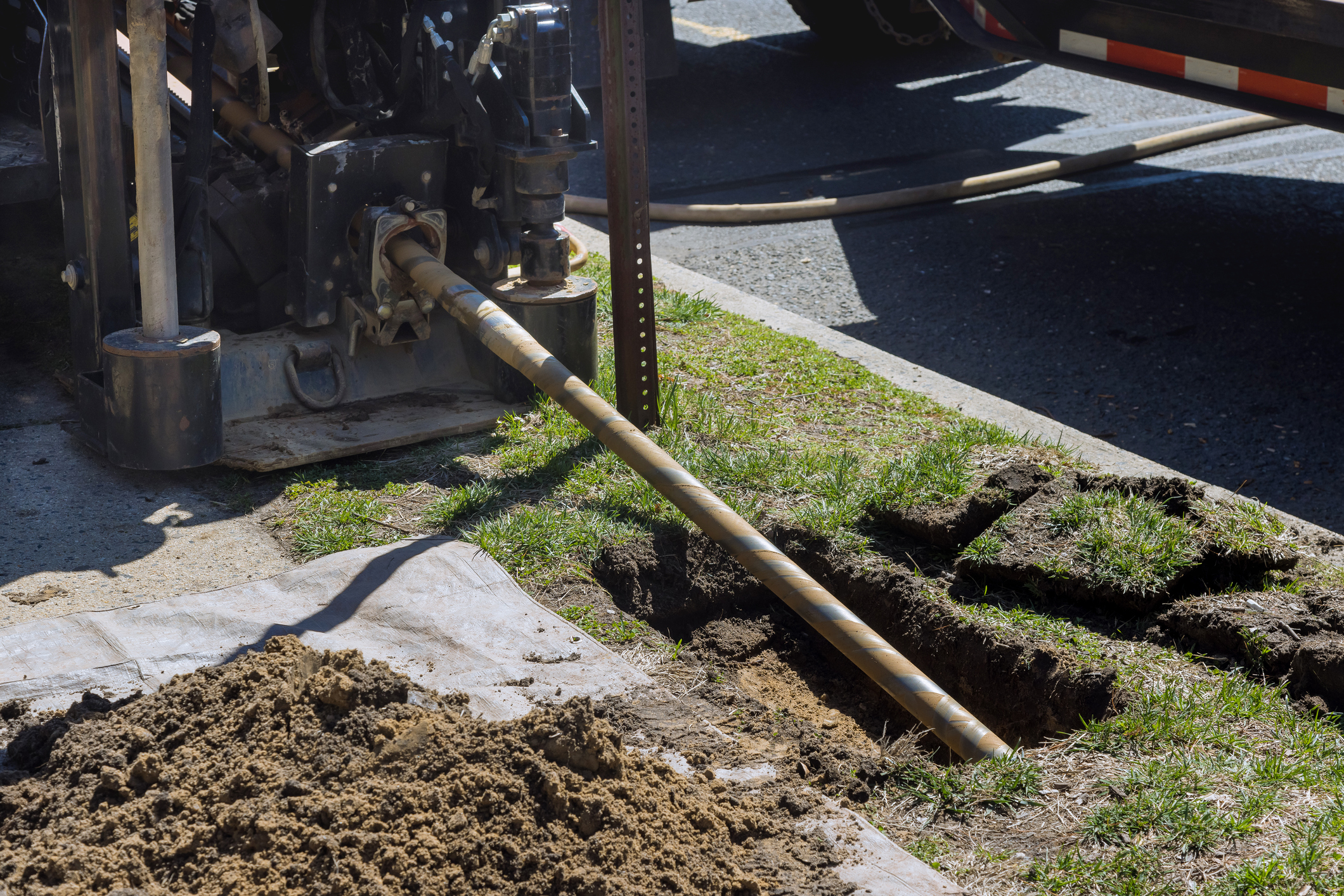 Trenchless sewer line repair being conducted outside.